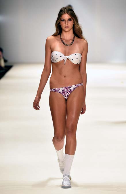 A model walks the runway in a design by Carena West at Swim show during Mercedes-Benz Fashion Week Australia 2014 in Sydney, Australia.