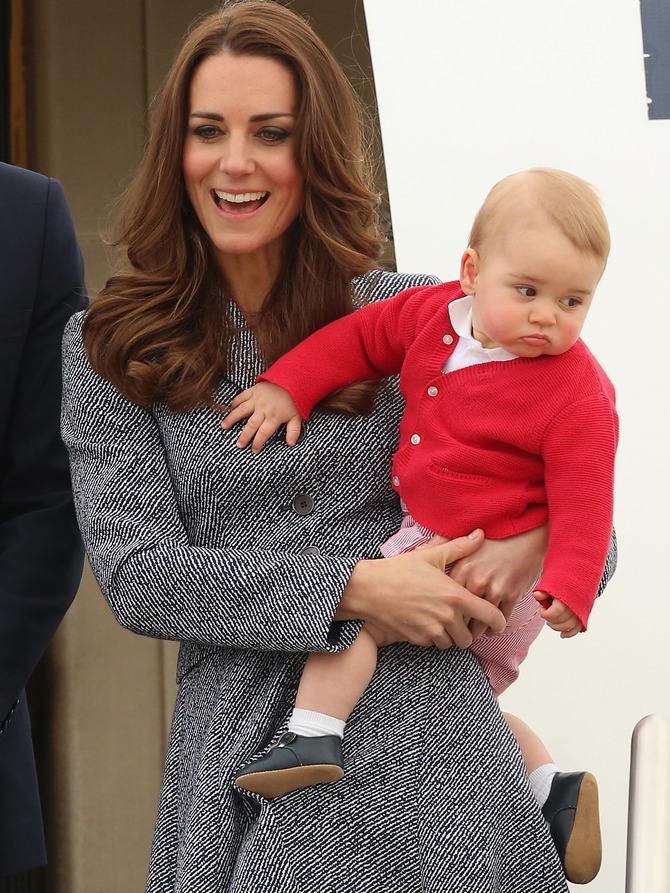 The Duchess of Cambridge holds Prince George of Cambridge as they leave Fairbairne Airbase to head back to the UK after finishing their Royal Visit to Australia.
