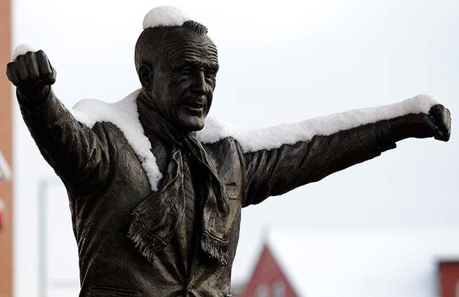 Snow covers a statue of legendary Liverpool manager Bill Shankly outside the club's Anfield stadium in Liverpool, northern England, December 18, 2010. Fresh snow brought much of Britain to a standstill on Saturday, on what is traditionally the busiest weekend for shopping and travel in the run-up to Christmas.