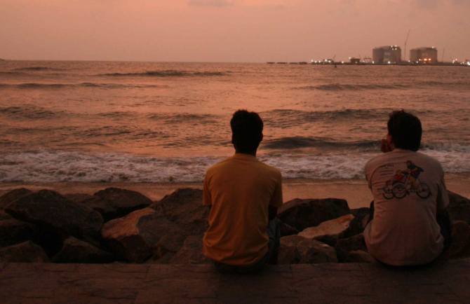Tourists enjoying a beautiful sunset at Kochi