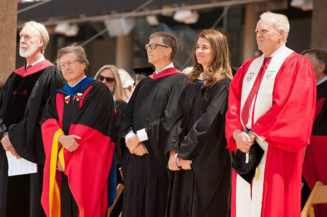 (LtoR)Dean for Religious Life at Stanford Rev Scotty McLennan,  Stanford Provost John Etchemendy, philanthropists Bill and Melinda Gates, and President John Hennessy at the commencement.