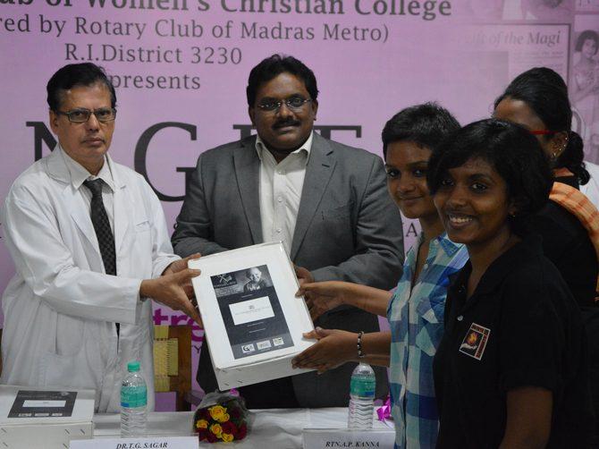 Dr Sagar and Dr Rejiv Rajendran receive the donations from young Rennee Saradha.