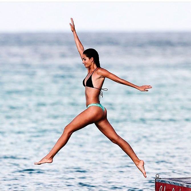  A teeny-weeny bikini clad Lily Aldridge seems to be enjoying herself as she takes a plunge in the blue waters.