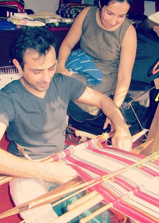 Mayank and Shraddha try their hand at weaving.