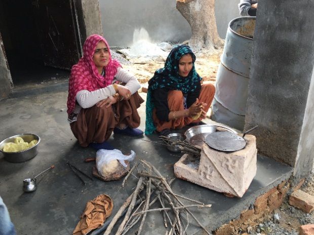Women in the village preparing makke ki roti