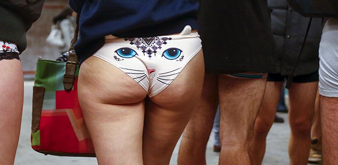 People take part in the 'No Pants Subway Ride' in Berlin, January 10, 2016. 