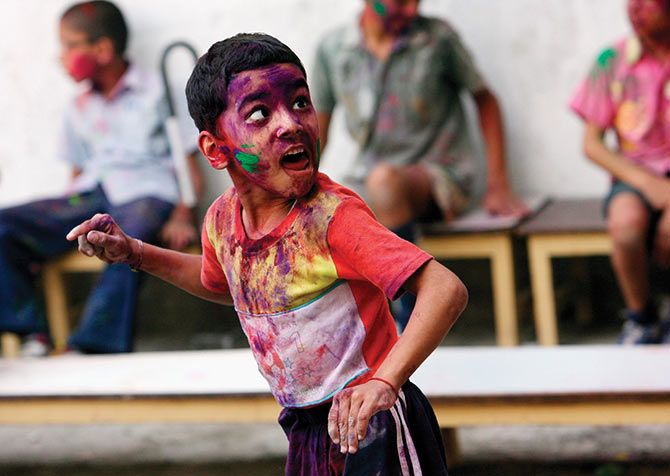 Rohan Mohite, an eight-year-old suffering from cerebral palsy, enjoys celebrating Holi. 