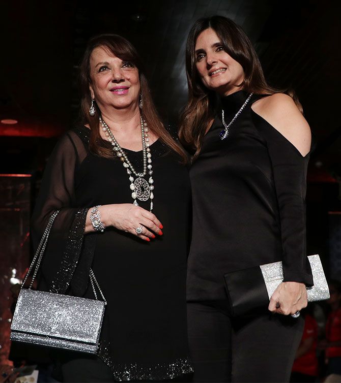 Zarine Khan posed with daughter Simone, both dazzled in black with glittering silver clutches and accessories