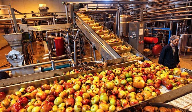 An apple juice manufacturing unit on the outskirts of Srinagar, October 15, 2012. Photograph: Danish Ismail/Reuters