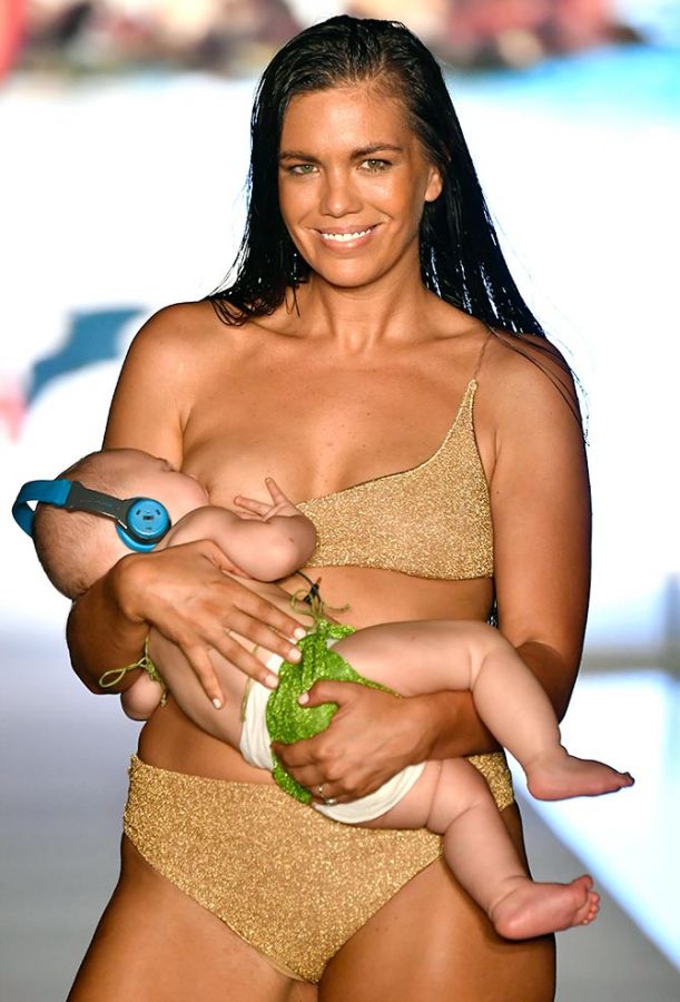 Mara Martin breastfeeds her 5-month-old daughter on the ramp