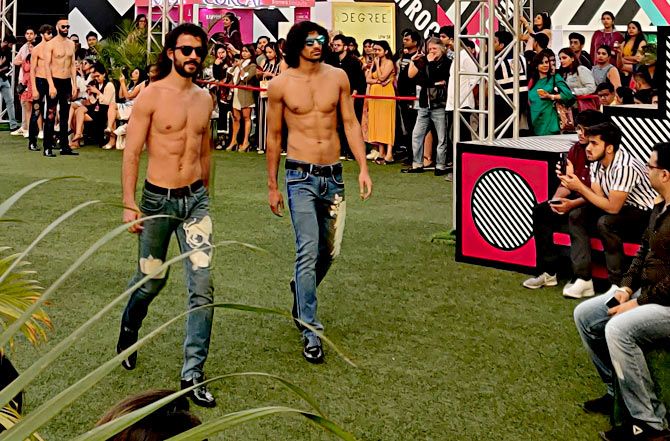 A few models walk out shirtless. Photograph: Kshamaya Daniel/Rediff.com.