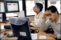 Alarmed stock brokers at BSE. Photo: ROB ELLIOTT/AFP/Getty Images