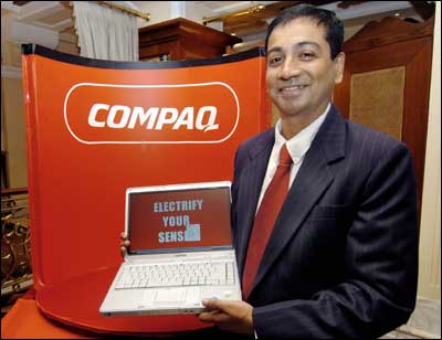 Ravi Swaminathan, vice president (personal systems group), Hewlett-Packard India Sales Pvt Ltd, poses with the newly launched Compaq Presario V2000 laptop in New Delhi on Wednesday. Photo: Prakash Singh/AFP/Getty Images