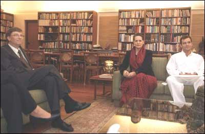 (In the picture): Microsoft Chairman and Chief Software Architect, Bill Gates (L) talks to Congress President and Chairperson of India's ruling United Progressive Alliance Sonia Gandhi while her son and member of Indian Parliament Rahul Gandhi (R) looks on in New Delhi on Tuesday. Photograph: Manpreet Romana / AFP / Getty Images