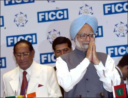 Prime Minister Manmohan Singh greeting participants at the SAARC Business Leaders Conclave in New Delhi on Thursday. Mackey Hashim, President, SCCI, is also seen. Photograph: UNI Photo