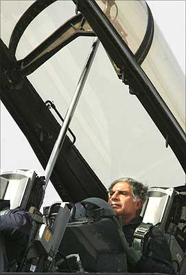 Tata chairman Ratan Tata, sits inside a US made F-16 aircraft after it landed during the second day of the Aero India 2007 at the Air Force Station, Yelahanka, in Bangalore, 08 February 2007. Photograph: Dibyangshu Sarkar/AFP/Getty Images
