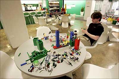 An employee plays with Lego at Google's New York City office, March 10, 2008.