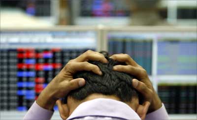 An Indian broker reacts while trading at a stock brokerage firm in Mumbai. | Photograph: REUTERS/Arko Datta