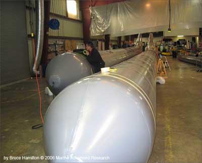 The Proteus, a cruiser known as Wave Adaptive Modular Vessel or WAM-V, blasts along on two giant inflatable tubes that let it 'dance' with waves.