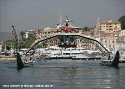 The Proteus, a cruiser known as Wave Adaptive Modular Vessel or WAM-V, blasts along on two giant inflatable tubes that let it 'dance' with waves.