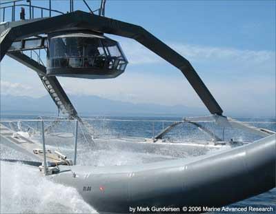 The Proteus, a cruiser known as Wave Adaptive Modular Vessel or WAM-V, blasts along on two giant inflatable tubes that let it 'dance' with waves.