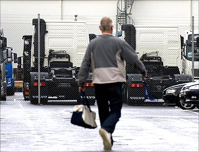 An employee leaves the Volvo AB truck plant in Tuve outside Gothenburg, Sweden