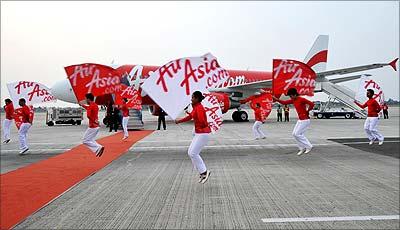 Dancers perform during a ceremony of welcoming the new Airbus A320 at Cengkareng airport in Jakarta.| Photograph:  Adek Berry/AFP/Getty Images