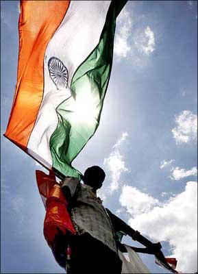 A boy waves the Indian flag. | Photograph: Dibyangshu Sarkar/AFP/Getty Images