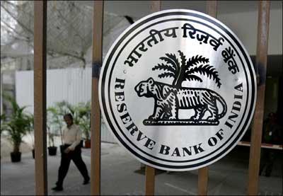 A man walks out of The Reserve Bank of India building in Mumbai. | Photograph: Sajjad Hussain/AFP/Getty Images