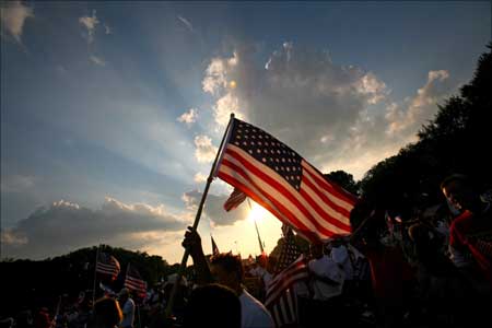 A protester calling for immigration law reform waves a US flag during a rally on the Washington Mall.