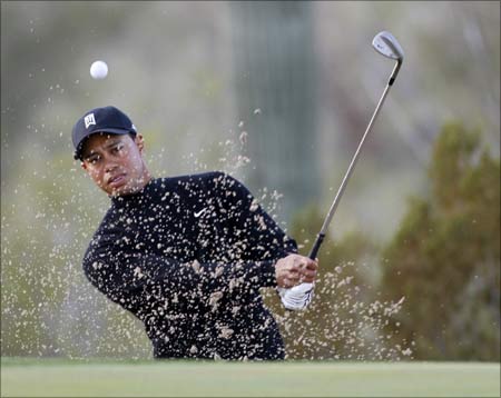 Tiger Woods hits onto the seventh green during practice for the World Golf Championships -- Accenture Match Play golf Championship in Marana, Arizona
