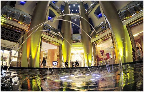 A view of the interior of the Burj Al Arab hotel in Dubai. Guests walk past one of the fountains at the Burj Al Arab hotel in Dubai.