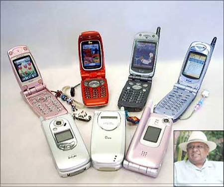 Mobile phones, B K Modi, chairman of Spice Group (inset). | Photograph: Rediff Archives