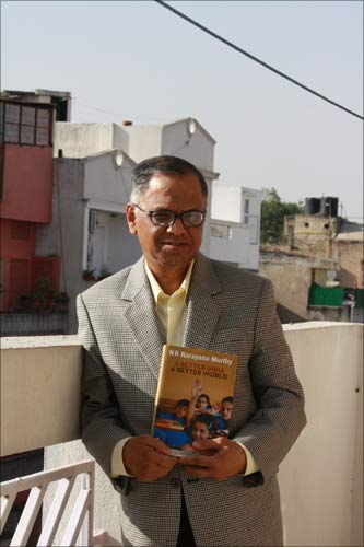 Narayana Murthy posing with his book on the terrace on Infosys guest house in New Delhi. | Photograph: Rajesh Karkera