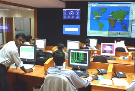  Engineers work in the control room at Infosys Technologies campus at Electronics City in Bangalore. | Photograph: Pawel Kopczynski/Reuters