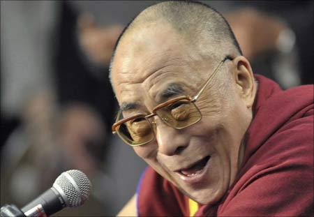 Exiled Tibetan spiritual leader the Dalai Lama laughs during a news conference in Santa Barbara, California. | Photograph: Phil Klein/Reuters