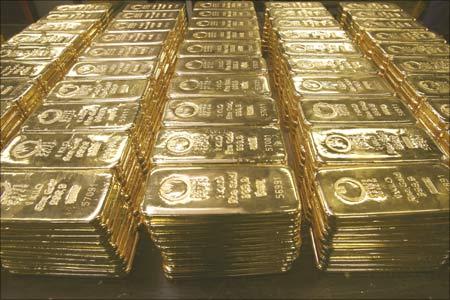 Gold bars are stored on a table at a plant of gold refiner and bar manufacturer Argor-Heraeus SA in the Swiss town of Mendrisio