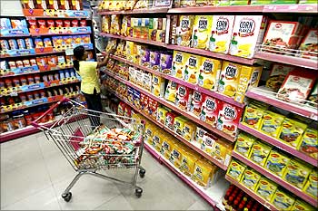 A customer collects food packets at a shopping mall in Siliguri