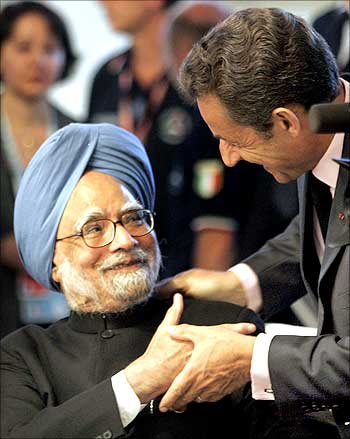 Prime Minister Manmohan Singh is greeted by France's President Nicolas Sarkozy during the G8 summit.