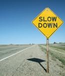 Slow down signpost