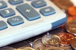 A calculator and some coins.