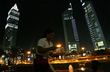 A waitress serves at Ziara Ramadan tent near the Emirates towers in Dubai.