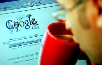 An internet surfer views the Google home page at a cafe in London.