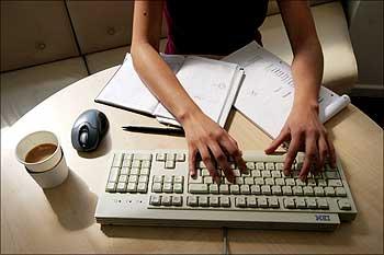 A generic picture of a woman working in an office.