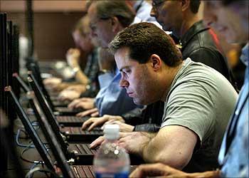 Comdexer checks email at cyber center in Las Vegas.