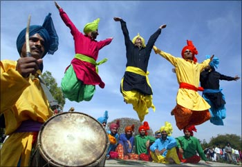 Indian folk dancers perform during the festival of gardens in Chandigarh.