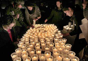 People light candles to urge world leaders to seal a real climate deal in Copenhagen.