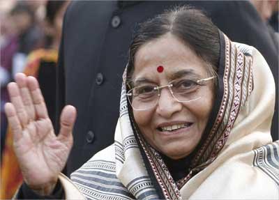 President Pratibha Patil waves during the 'At Home' reception at the presidential palace after the Republic Day parade in New Delhi. | Photograph: Desmond Boylan/Reuters B Mathur