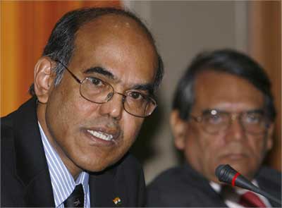 Reserve Bank of India Governor Duvvuri Subbarao (L) speaks as deputy governor Rakesh Mohan watches. | Photograph: Punit Paranjpe/Reuters