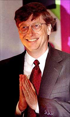 Bill Gates joins his hands together in a namaste